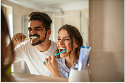 Couple brushing teeth